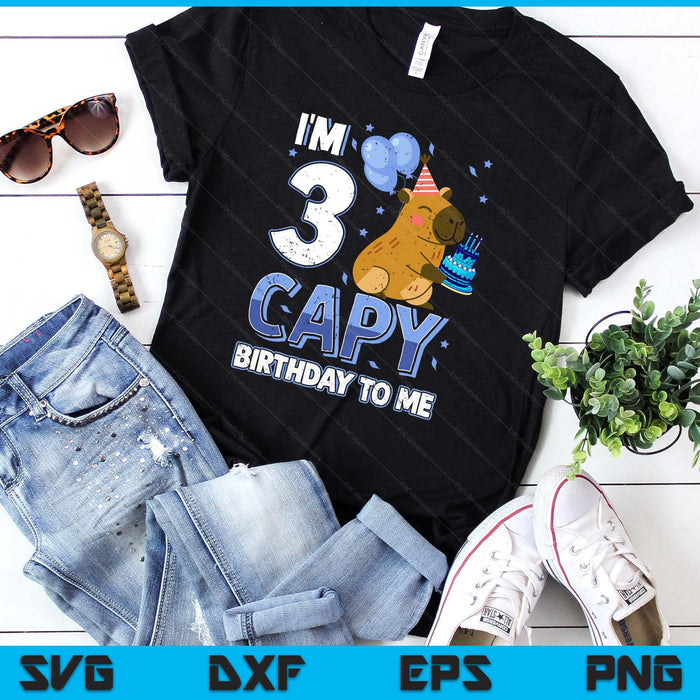 A capybara in a party hat holding a birthday cake beside the words I'm 3 Capy Birthday To Me, on a black t-shirt