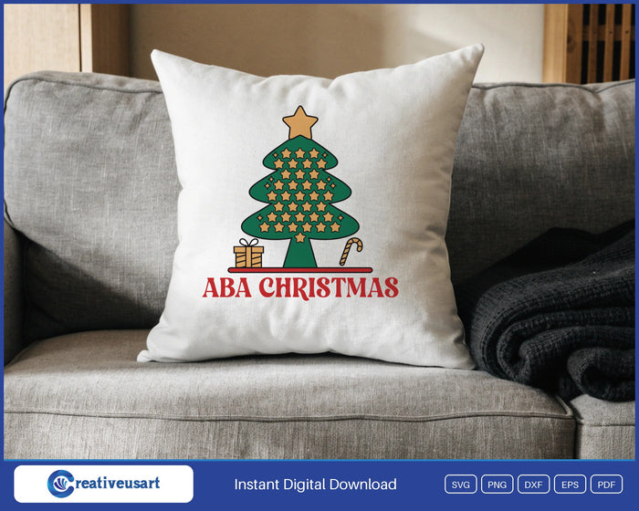 ABA Christmas with a star tree, gift and candy cane SVG design on a white throw pillow