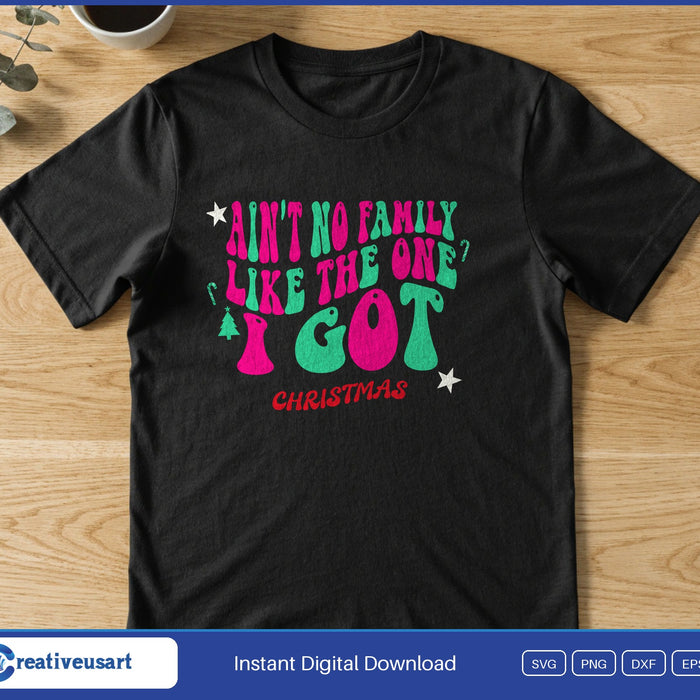 Wavy retro pink and green letters reading Ain't No Family Like The One I Got Christmas, on a black t-shirt