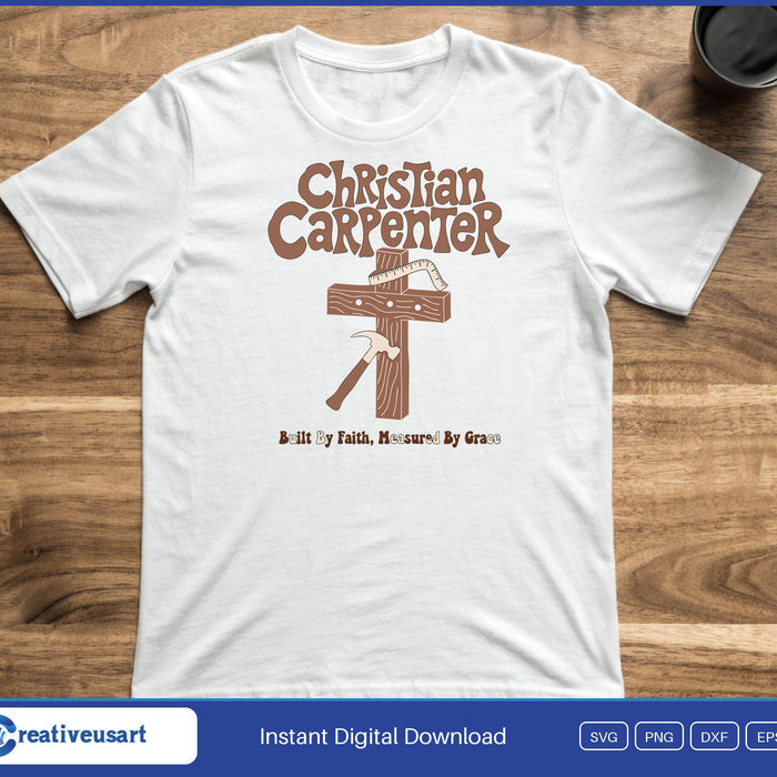 A wooden cross with a hammer below the words Christian Carpenter and Built By Faith, Measured By Grace, on a white t-shirt