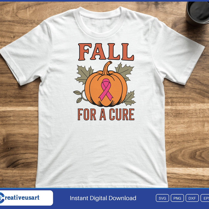 An orange pumpkin with a pink ribbon on it, between the words Fall and For A Cure, on a white t-shirt