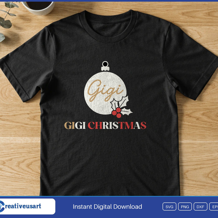 A white Christmas ornament with holly reading Gigi, above the words Gigi Christmas, on a black t-shirt