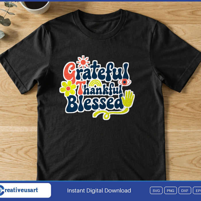 Groovy retro lettering reading Grateful Thankful Blessed with small flowers, on a black t-shirt