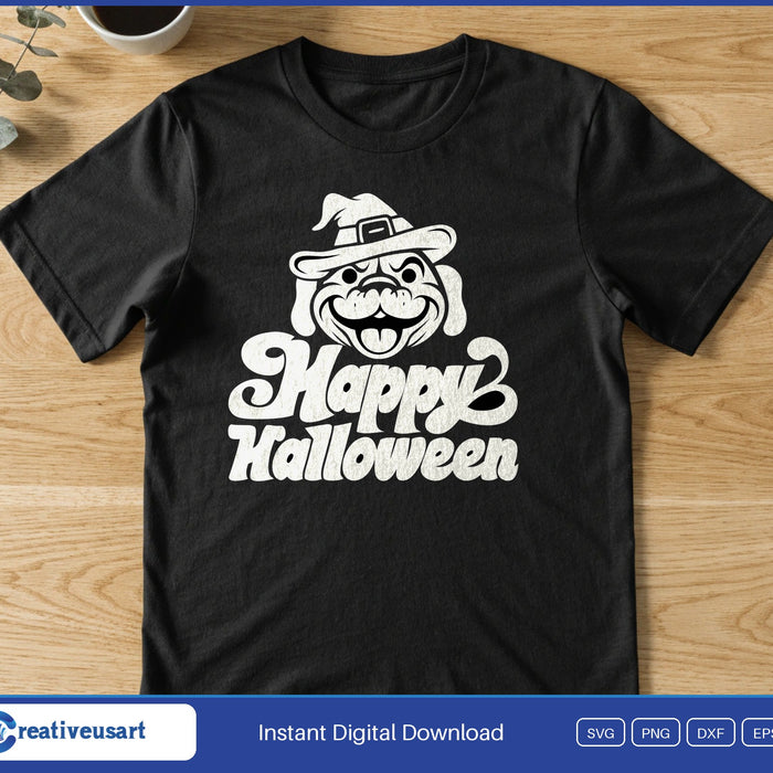 A grinning bulldog in a witch hat with its tongue out, above the retro words Happy Halloween, on a black t-shirt