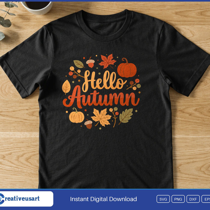 The words Hello Autumn inside a wreath of fall leaves, pumpkins and acorns, on a black t-shirt