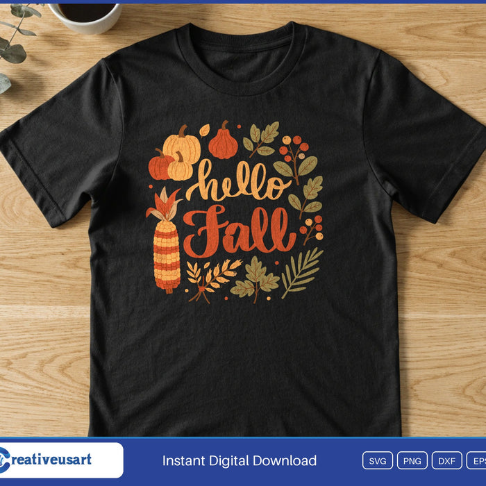The words Hello Fall inside a wreath of pumpkins, corn, leaves and berries, on a black t-shirt