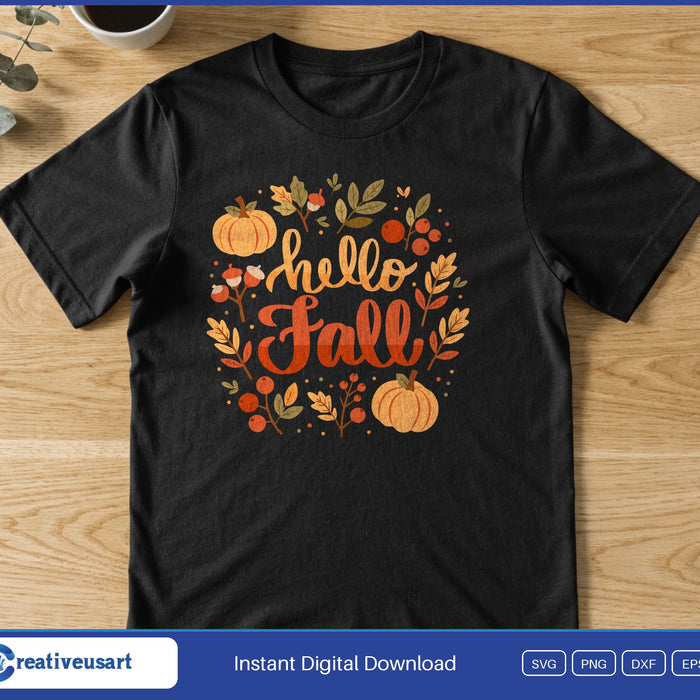 A wreath of leaves, berries, acorns and pumpkins around the words Hello Fall, on a black t-shirt