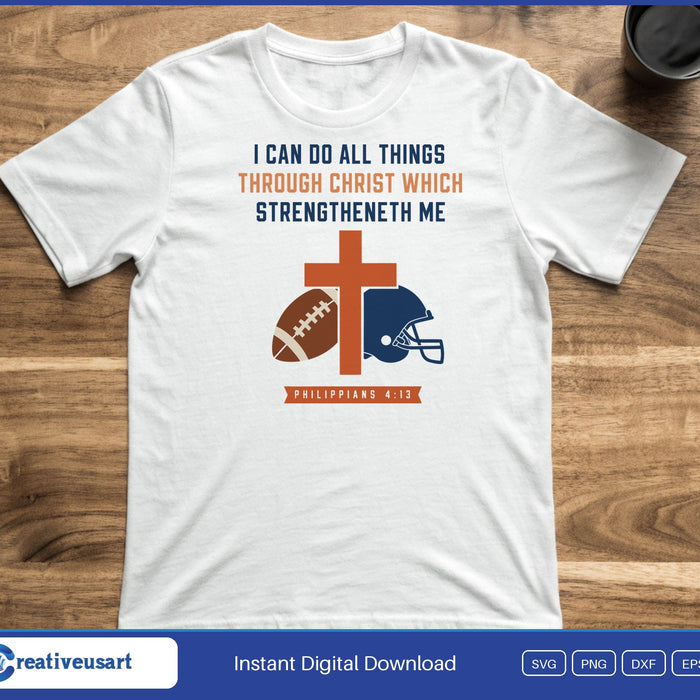 A cross, football and helmet under the words I Can Do All Things Through Christ, Philippians 4:13, on a white t-shirt