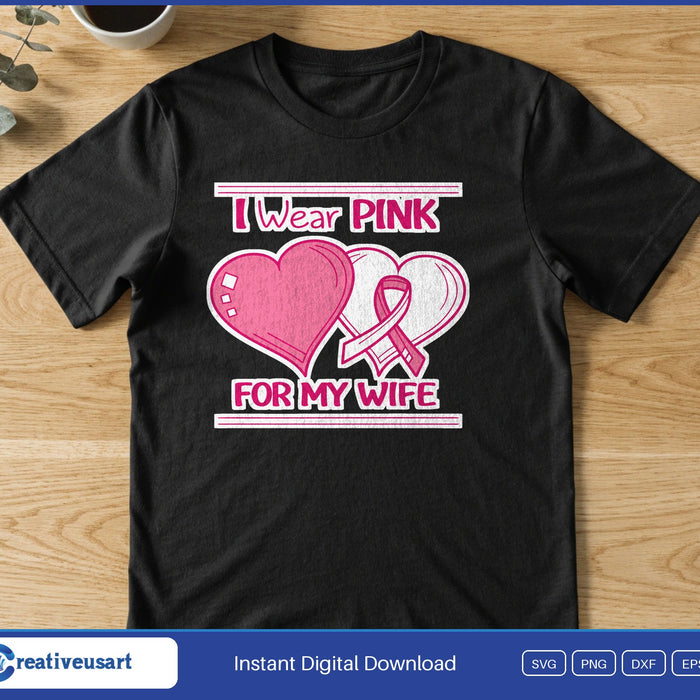 Two hearts, one pink and one white with a pink ribbon, between the words I Wear Pink For My Wife, on a black t-shirt