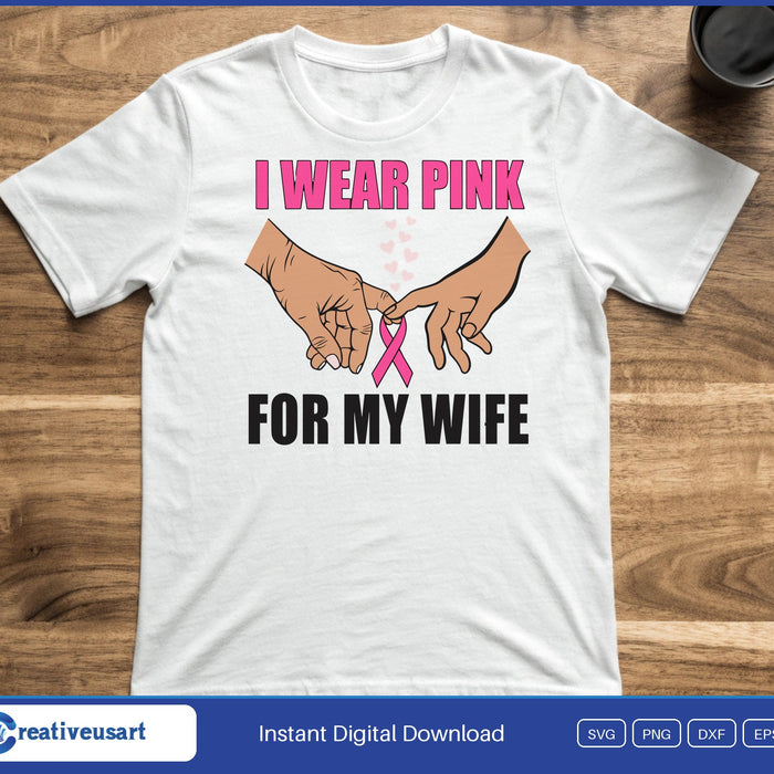 Two hands linking pinkies with a pink ribbon below, between the words I Wear Pink and For My Wife, on a white t-shirt