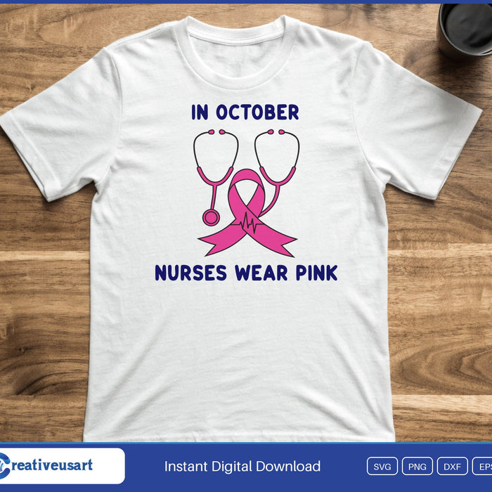 A stethoscope with a pink ribbon between the words In October and Nurses Wear Pink, on a white t-shirt
