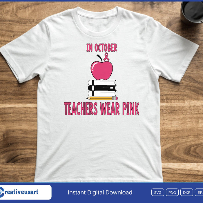 A pink apple with a ribbon on a stack of books, between the words In October and Teachers Wear Pink, on a white t-shirt