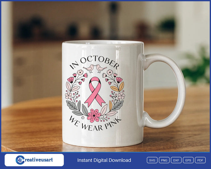 In October We Wear Pink folk flower wreath with a pink ribbon SVG design on a white coffee mug