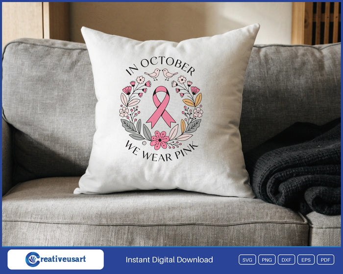 In October We Wear Pink folk flower wreath with a pink ribbon SVG design on a white throw pillow