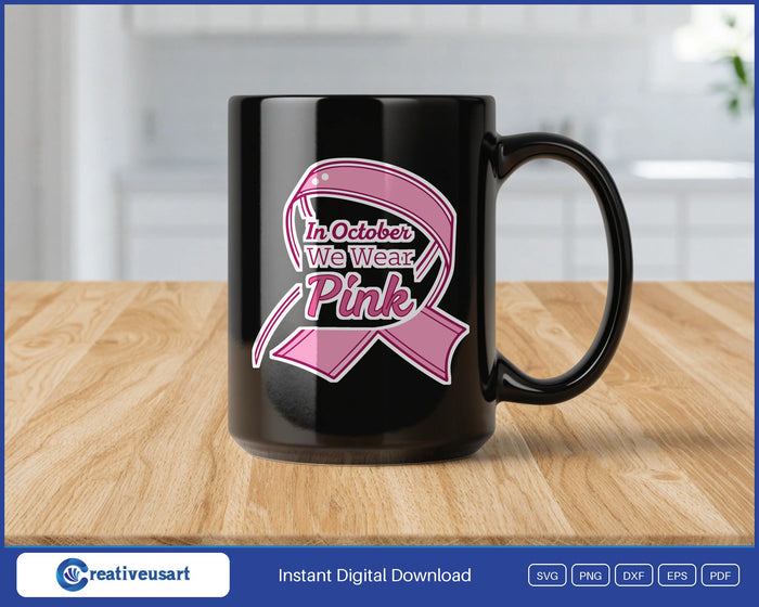 In October We Wear Pink script ribbon SVG design on a black coffee mug