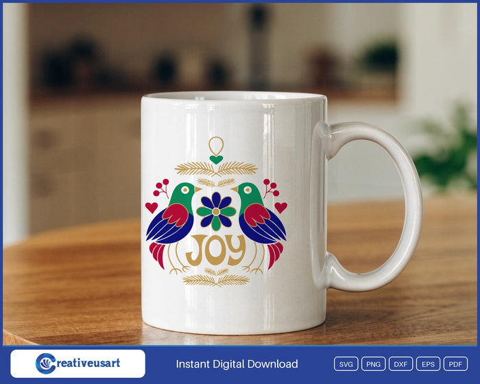 Joy folk art Christmas ornament birds SVG design on a white coffee mug