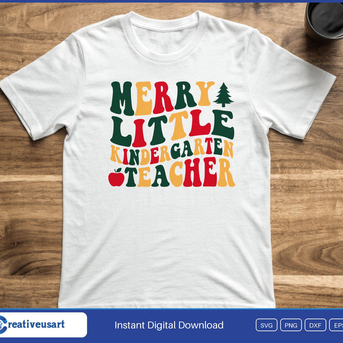 Retro wavy letters in green, red and gold reading Merry Little Kindergarten Teacher with a tree and an apple, on a white t-shirt