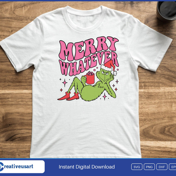 A grumpy green holiday character in a Santa hat lounging with a mug of cocoa under the words Merry Whatever, on a white t-shirt