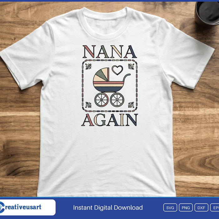 A cross stitch style sampler with a baby pram and a heart between the words Nana Again, on a white t-shirt