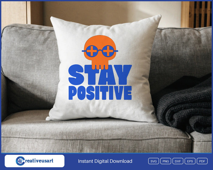 Stay Positive skull SVG design on a throw pillow