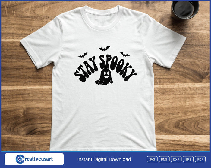 Stay Spooky retro ghost and bats Halloween SVG printed on a white t-shirt