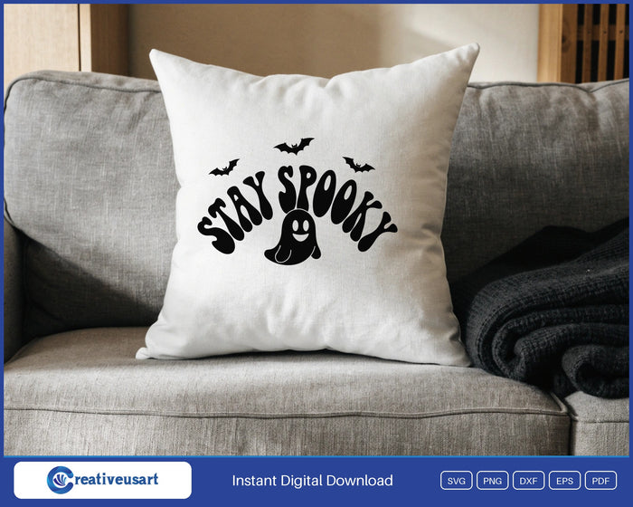 Stay Spooky retro ghost and bats Halloween SVG design on a white throw pillow
