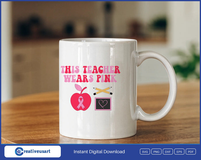 This Teacher Wears Pink breast cancer awareness apple ribbon SVG design on a white coffee mug