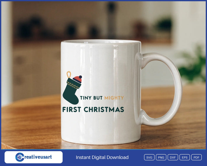 Tiny But Mighty First Christmas with a small stocking and knitted hat SVG design on a white coffee mug