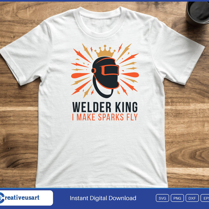 A welding helmet with a gold crown and orange sparks above the words Welder King I Make Sparks Fly, on a white t-shirt