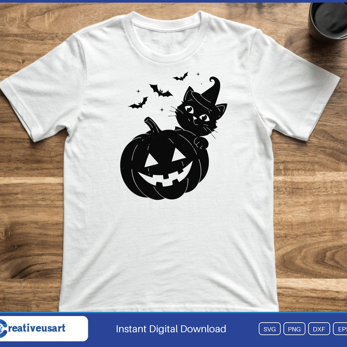 A black cat in a witch hat hugging a jack-o-lantern with bats above, on a white t-shirt