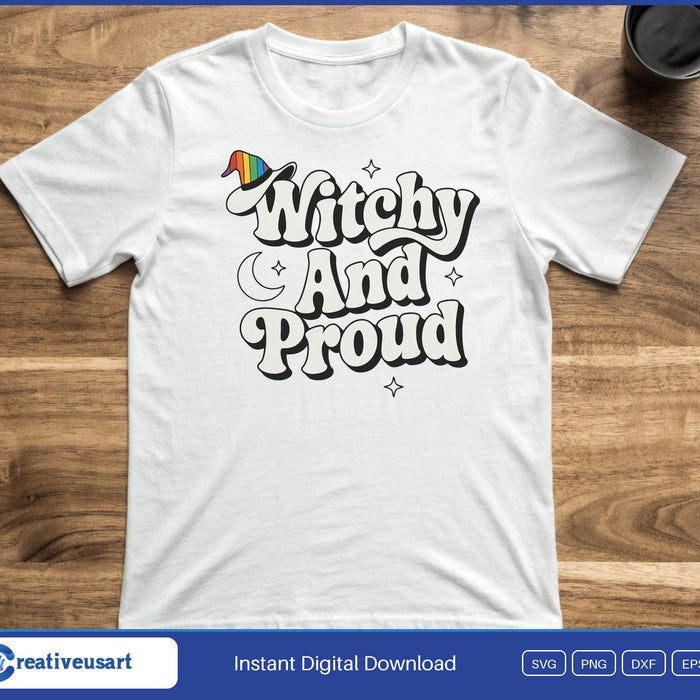 A rainbow witch hat and a moon beside the words Witchy And Proud in retro letters, on a white t-shirt